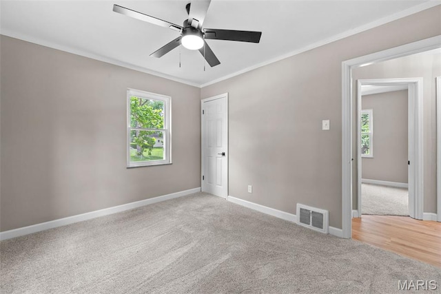 1247 Charlane Ct, Saint Louis, MO 63119 - spare room with carpet floors, crown molding, and a ceiling fan