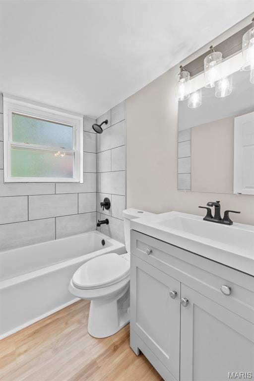 1247 Charlane Ct, Saint Louis, MO 63119 - full bath featuring vanity, wood finished floors, and shower / bathtub combination