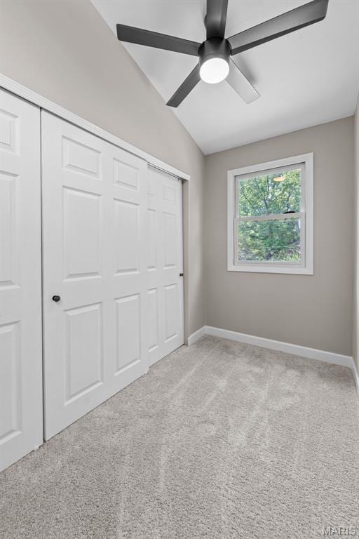 1247 Charlane Ct, Saint Louis, MO 63119 - unfurnished bedroom featuring a closet, vaulted ceiling, light carpet, and a ceiling fan