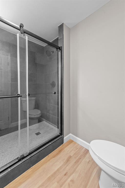 1247 Charlane Ct, Saint Louis, MO 63119 - full bathroom with a stall shower and wood finished floors