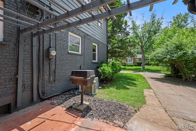 1247 Charlane Ct, Saint Louis, MO 63119 - view of side of property with brick siding and a yard