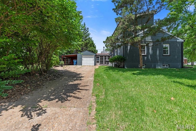 1247 Charlane Ct, Saint Louis, MO 63119 - view of grassy yard featuring driveway and a garage