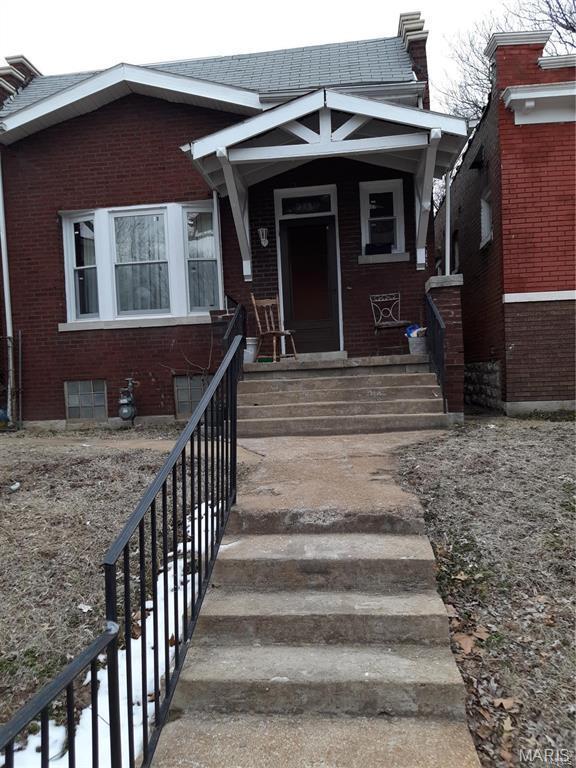 5119 Terry Ave, Saint Louis, MO 63115 - doorway to property with brick siding