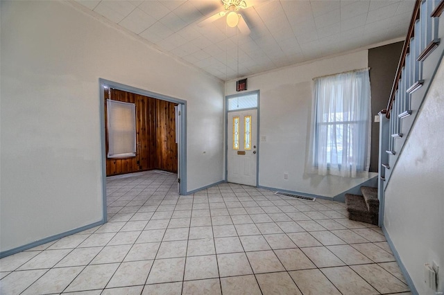 342 N Adams Ave, Lebanon, MO 65536 - foyer entrance featuring stairs, baseboards, ceiling fan, and light tile patterned floors