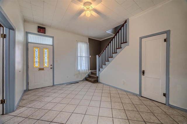 342 N Adams Ave, Lebanon, MO 65536 - foyer entrance with stairs, light tile patterned flooring, ceiling fan, baseboards, and crown molding