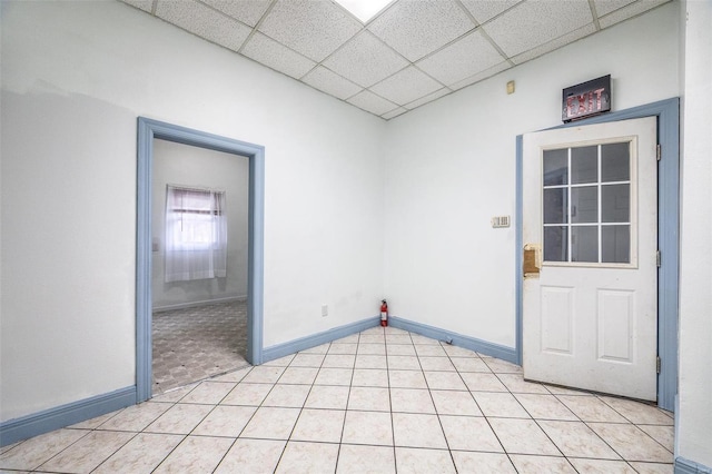 342 N Adams Ave, Lebanon, MO 65536 - unfurnished room with light tile patterned flooring, a paneled ceiling, and baseboards