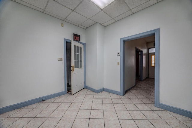 342 N Adams Ave, Lebanon, MO 65536 - unfurnished room featuring a drop ceiling, baseboards, and light tile patterned flooring