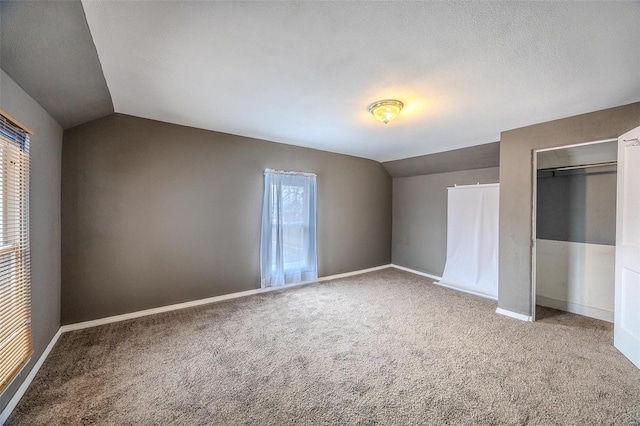 342 N Adams Ave, Lebanon, MO 65536 - unfurnished bedroom with lofted ceiling, carpet, baseboards, and a closet