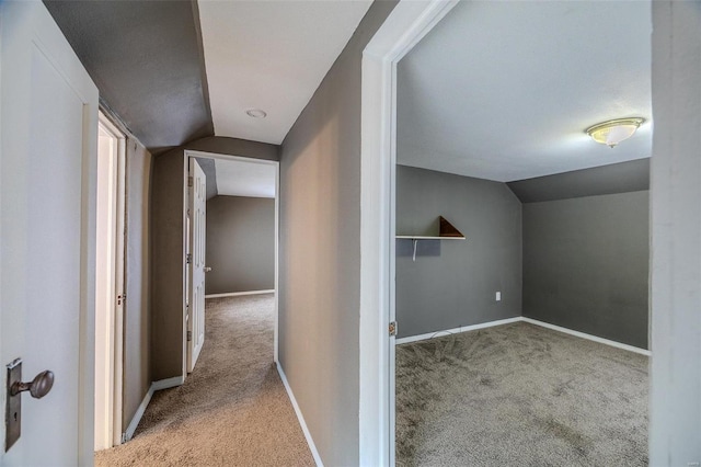 342 N Adams Ave, Lebanon, MO 65536 - hall featuring carpet, vaulted ceiling, and baseboards