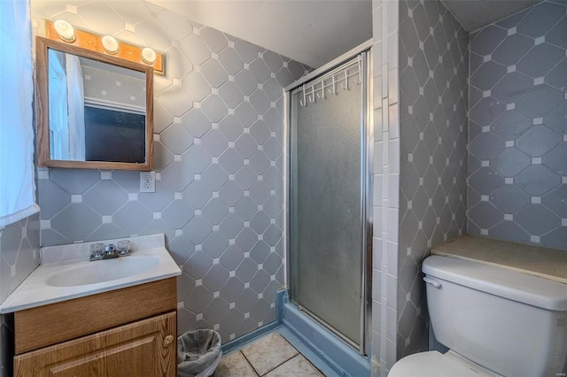 342 N Adams Ave, Lebanon, MO 65536 - full bath featuring tile walls, a shower stall, toilet, vanity, and tile patterned flooring