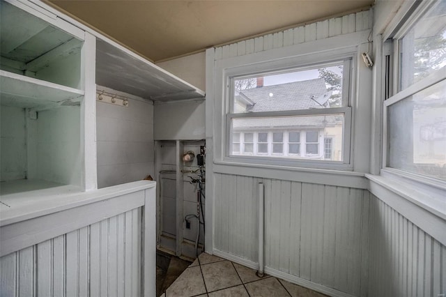 342 N Adams Ave, Lebanon, MO 65536 - washroom featuring tile patterned floors and wood walls