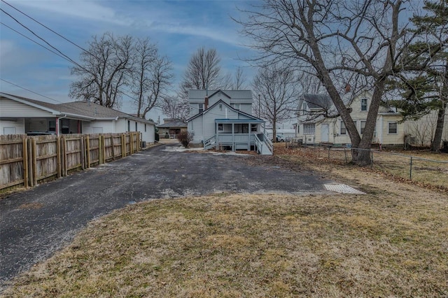 342 N Adams Ave, Lebanon, MO 65536 - rear view of house featuring asphalt driveway