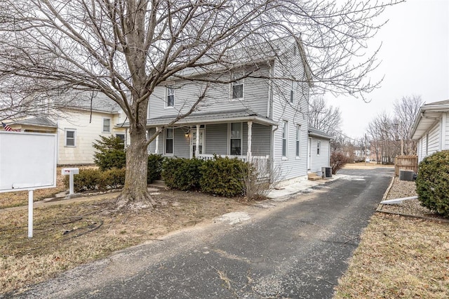 342 N Adams Ave, Lebanon, MO 65536 - view of front of property with central AC, driveway, and a porch