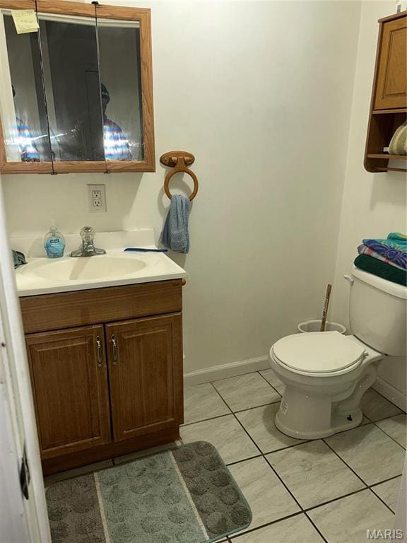 618 Church St, Hannibal, MO 63401 - bathroom with vanity and tile patterned flooring