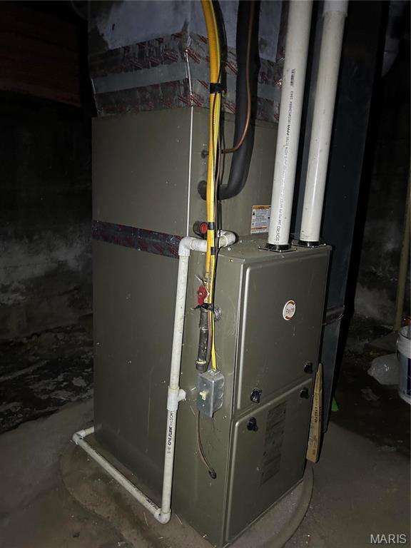 618 Church St, Hannibal, MO 63401 - utility room featuring heating unit