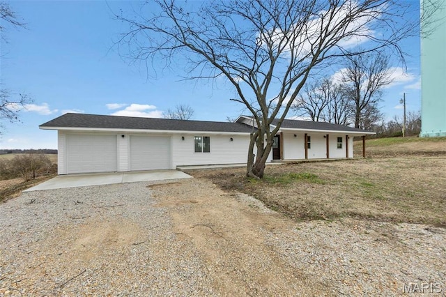 18211 State Highway J, Malden, MO 63863 - view of front facade featuring driveway, a garage, and a porch