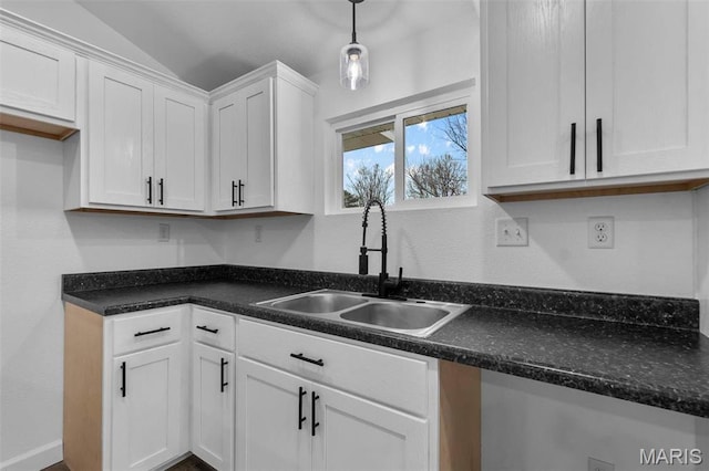 18211 State Highway J, Malden, MO 63863 - kitchen with a sink, white cabinets, dark countertops, lofted ceiling, and decorative light fixtures