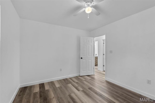 18211 State Highway J, Malden, MO 63863 - empty room featuring wood finished floors, ceiling fan, and baseboards