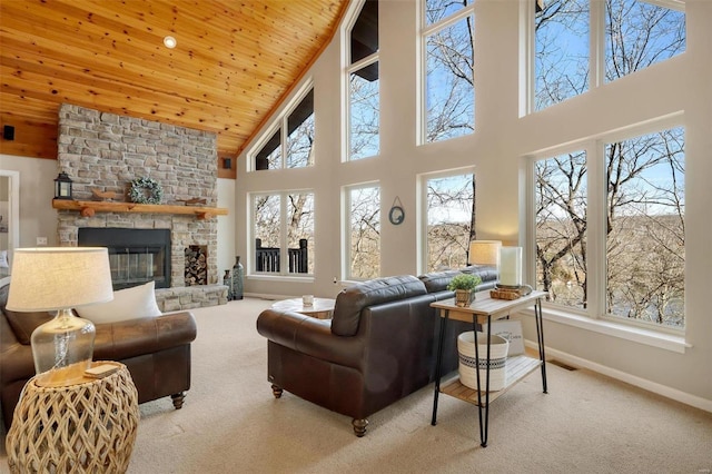 12054 Anthonies Mill Rd, Bourbon, MO 65441 - living area featuring high vaulted ceiling, wooden ceiling, carpet floors, a stone fireplace, and baseboards