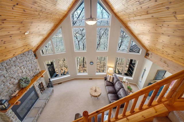 12054 Anthonies Mill Rd, Bourbon, MO 65441 - living area featuring high vaulted ceiling, a fireplace, wood ceiling, carpet flooring, and stairs