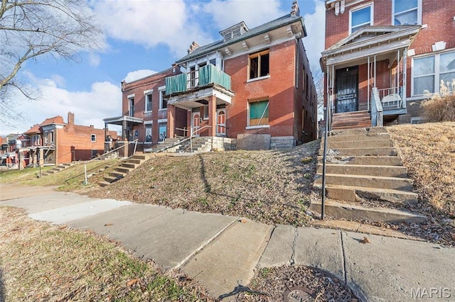 5943 Page Blvd, Saint Louis, MO 63112 - view of building exterior featuring stairway and a residential view