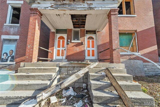 5943 Page Blvd, Saint Louis, MO 63112 - property entrance with brick siding and covered porch