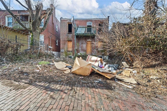 5943 Page Blvd, Saint Louis, MO 63112 - back of house featuring brick siding and fence