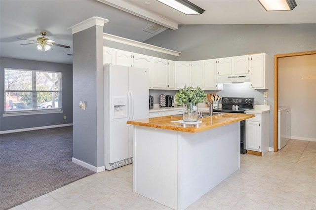 kitchen featuring white refrigerator with ice dispenser, black / electric stove, separate washer and dryer, under cabinet range hood, and butcher block counters