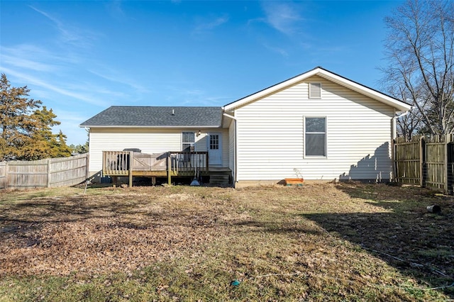 back of property featuring a deck