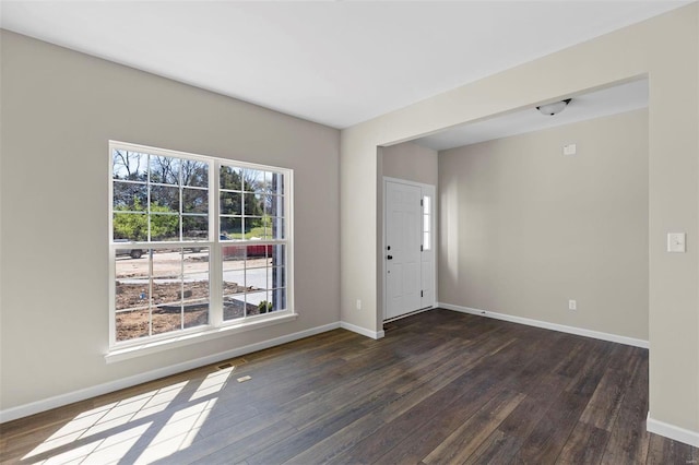 317 Winding Bluffs Ct, Fenton, MO 63026 - entryway featuring dark wood finished floors and baseboards