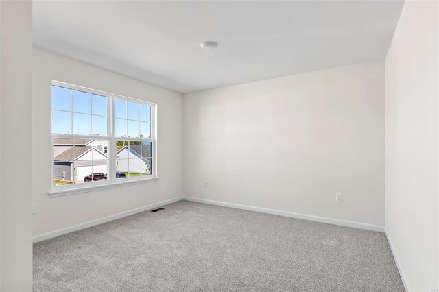 317 Winding Bluffs Ct, Fenton, MO 63026 - carpeted spare room featuring baseboards