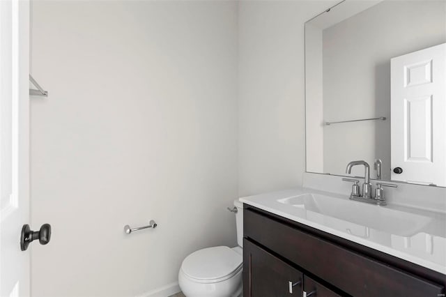 317 Winding Bluffs Ct, Fenton, MO 63026 - bathroom with toilet, vanity, and baseboards
