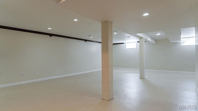 basement with recessed lighting, baseboards, and healthy amount of natural light