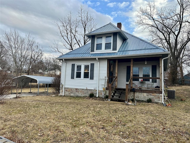 807 E 4th St, Salem, MO 65560 - view of front of house with a carport, a porch, metal roof, a chimney, and a front yard