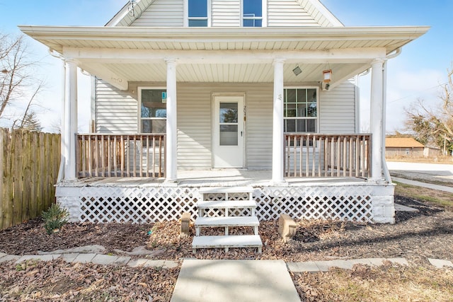204 S Railroad St, Medora, IL 62063 - view of exterior entry with covered porch and fence
