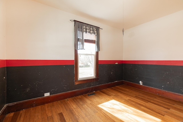 204 S Railroad St, Medora, IL 62063 - empty room featuring baseboards and wood finished floors