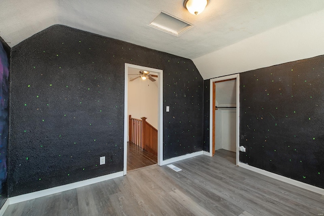 204 S Railroad St, Medora, IL 62063 - unfurnished bedroom with vaulted ceiling, wood finished floors, baseboards, and a closet