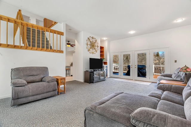carpeted living room with french doors, baseboards, a ceiling fan, and recessed lighting