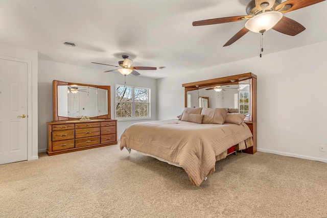 bedroom with light carpet, baseboards, and a ceiling fan