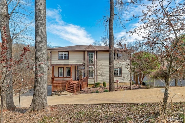 956 Long Bow Dr, Marthasville, MO 63357 - rear view of house featuring covered porch