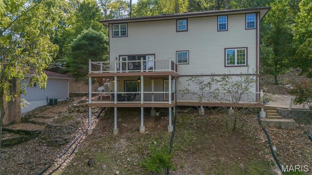 956 Long Bow Dr, Marthasville, MO 63357 - rear view of property with a wooden deck, view of scattered trees, and central AC