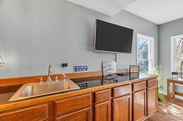 1972 Sugar Hollow Ct, Marthasville, MO 63357 - kitchen featuring brown cabinetry and light wood-style floors