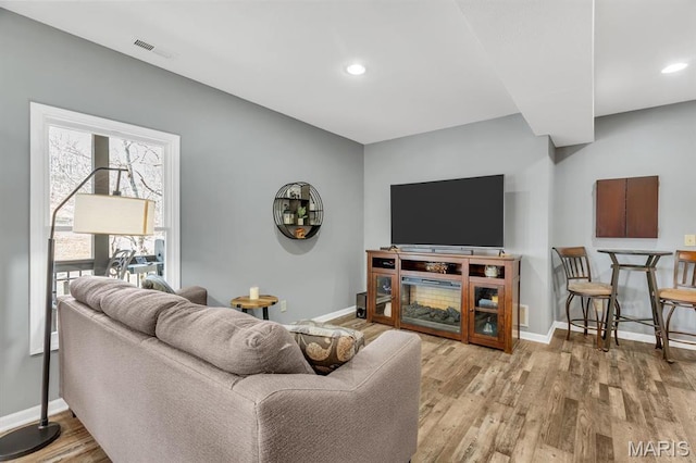 1972 Sugar Hollow Ct, Marthasville, MO 63357 - living room featuring wood finished floors and recessed lighting