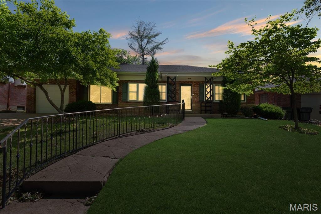 5840 Jamieson Ave, Saint Louis, MO 63109 - view of front facade featuring brick siding and a garage