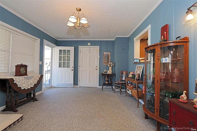111 S Ziegler St, Pilot Knob, MO 63663 - entryway featuring crown molding, carpet floors, a chandelier, and baseboards