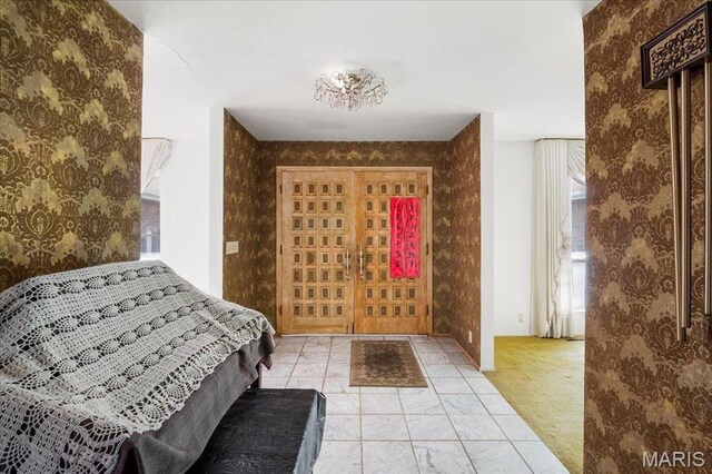 32 Briarcliffe Dr, Collinsville, IL 62234 - foyer entrance featuring wallpapered walls and plenty of natural light