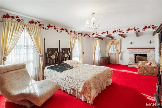32 Briarcliffe Dr, Collinsville, IL 62234 - carpeted bedroom with a chandelier and a fireplace