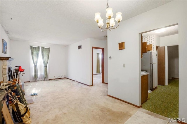 32 Briarcliffe Dr, Collinsville, IL 62234 - unfurnished living room with light carpet and a chandelier