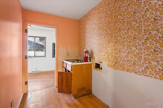 32 Briarcliffe Dr, Collinsville, IL 62234 - hall with light wood-style floors and wallpapered walls