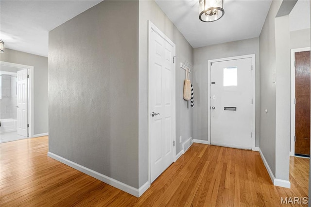 5816 Jamieson Ave, Saint Louis, MO 63109 - foyer entrance with light wood-type flooring and baseboards